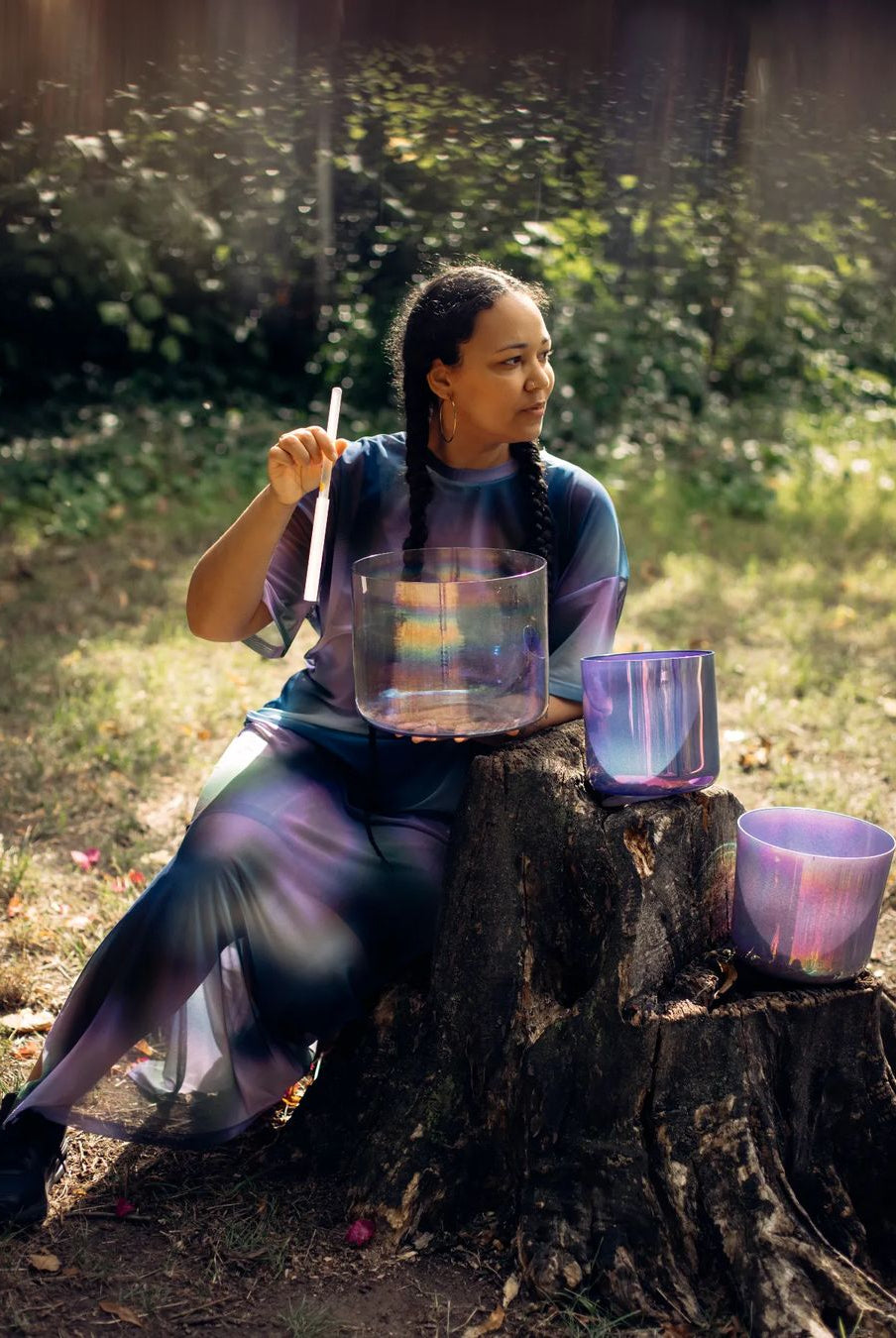 Girl playing her set of Cosmic Sound Bowls