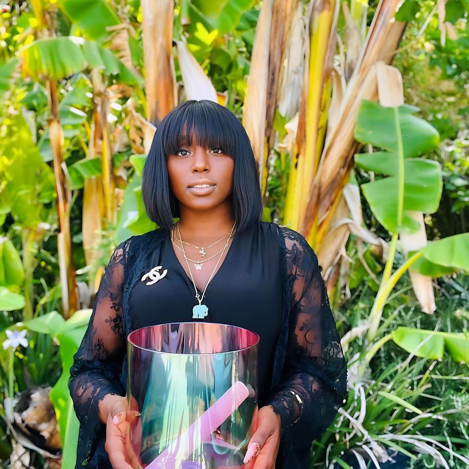 Blessed Abundant holding her beautiful Cosmic Sound Bowl