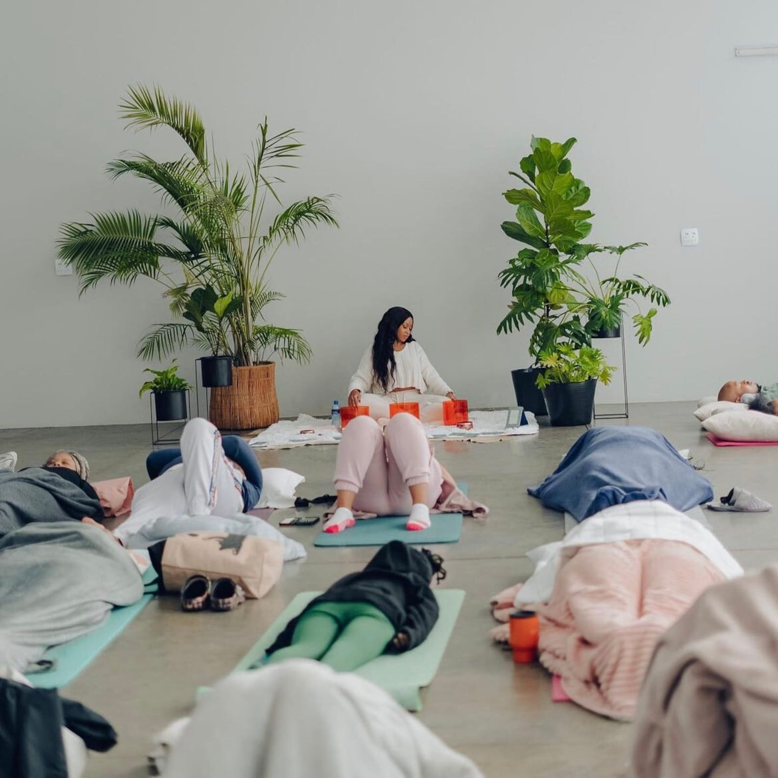 Group of people holding a sound bath with Cosmic Sound Bowls® 'Naturally Grounded' Singing Bowls