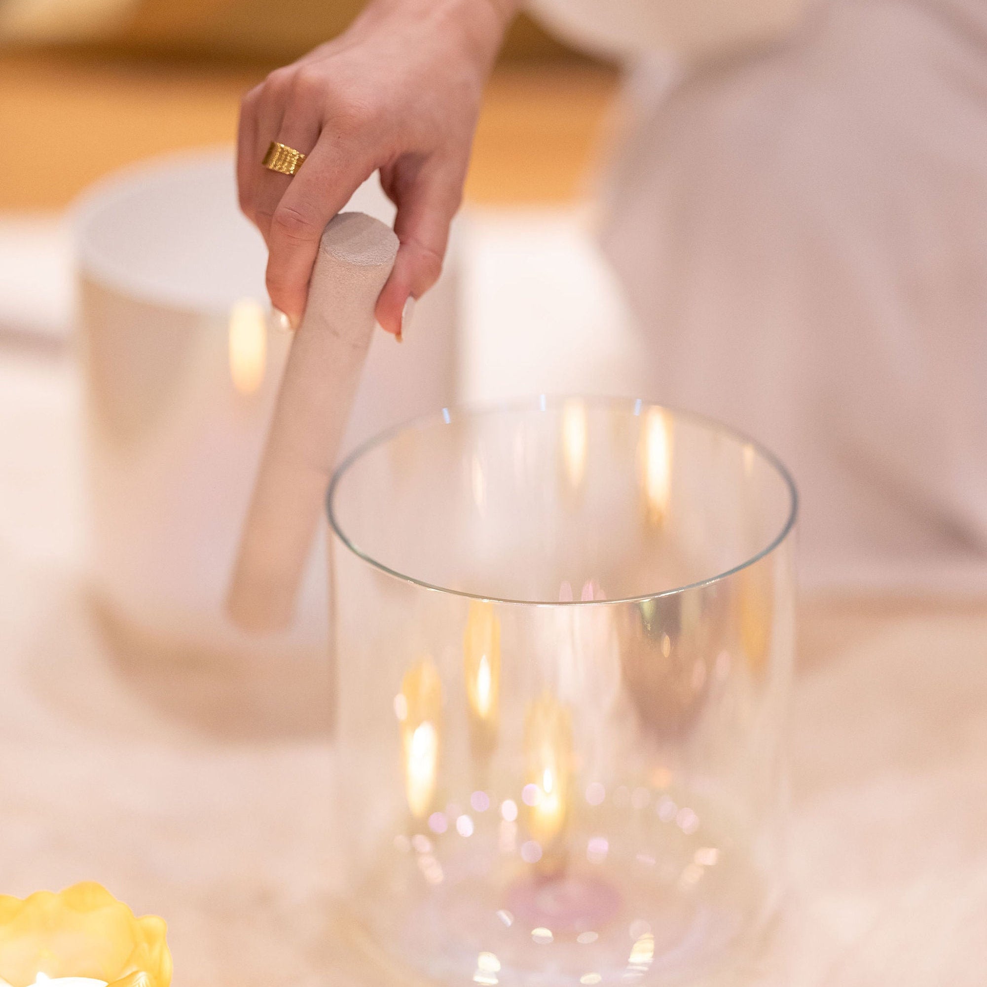 Hand with mallet playing Opal Moon Bowl