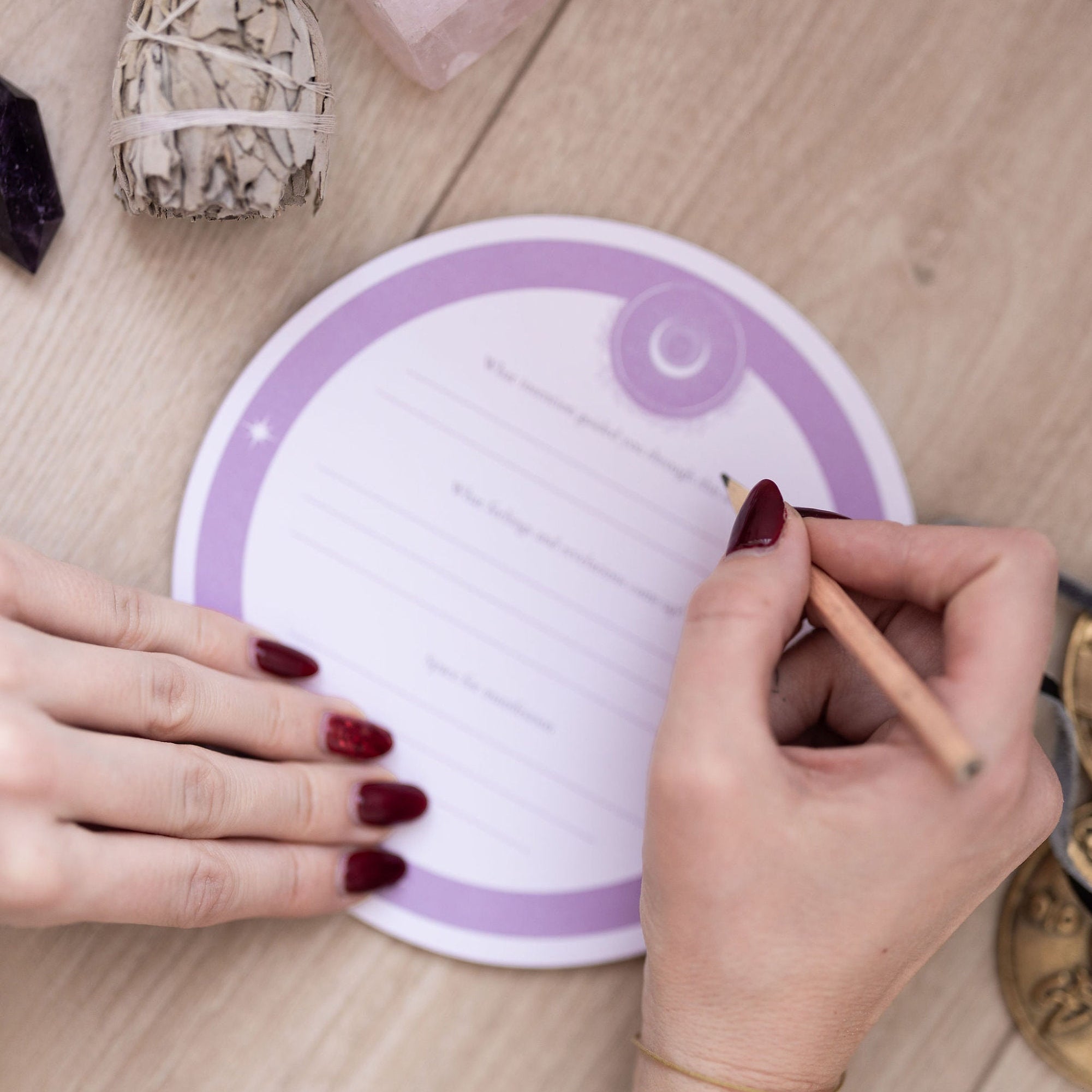 Hand writing on a Cosmic Sound Bowls® - Mindful Notepads