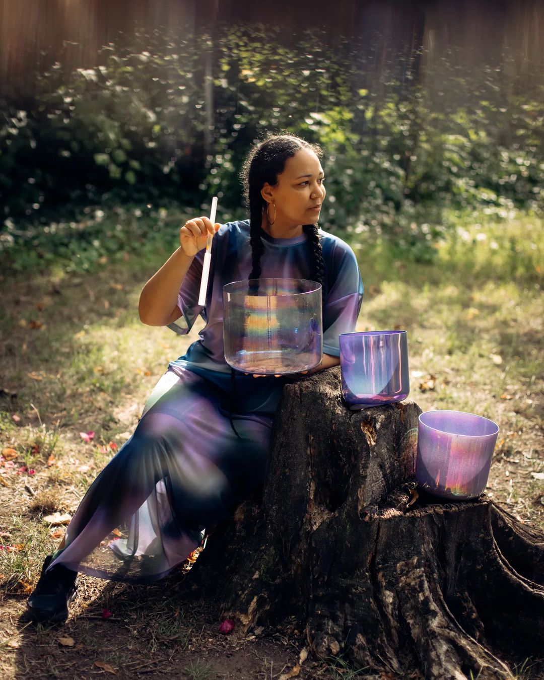 Girl playing her set of Cosmic Sound Bowls