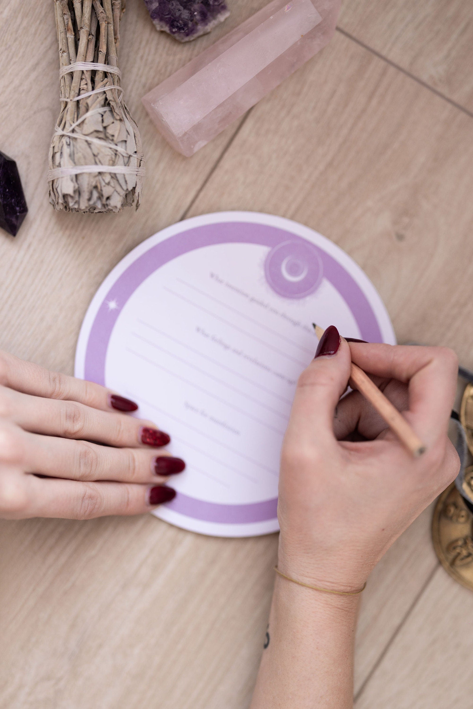 Hand writing on a Cosmic Sound Bowls® - Mindful Notepads